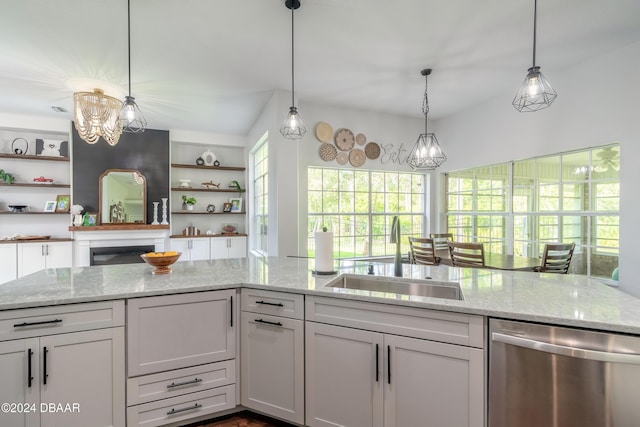 kitchen with dishwasher, a sink, open shelves, a chandelier, and light stone countertops