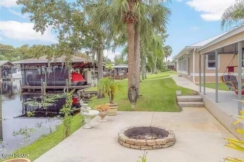 view of patio / terrace with a fire pit