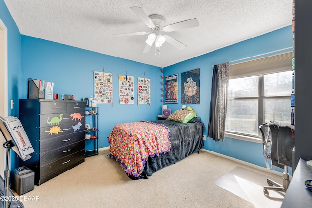 1600 Big Tree Rd Unit E8, Daytona Beach, FL 32119 - carpeted bedroom featuring a textured ceiling, ceiling fan, and baseboards