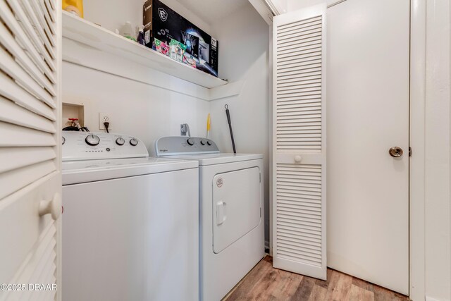 1600 Big Tree Rd Unit E8, Daytona Beach, FL 32119 - clothes washing area with separate washer and dryer and light wood-style floors