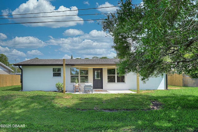 550 Eagle Dr, Holly Hill, FL 32117 - back of property with a patio area