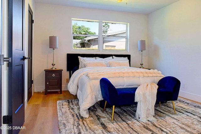 550 Eagle Dr, Holly Hill, FL 32117 - bedroom with wood finished floors and baseboards