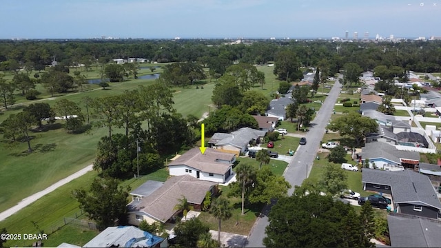 550 Eagle Dr, Holly Hill, FL 32117 - aerial perspective of suburban area featuring a nearby body of water, a golf club, and a tree filled landscape
