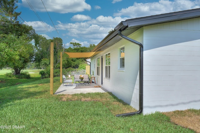 550 Eagle Dr, Holly Hill, FL 32117 - view of grassy yard featuring a patio area