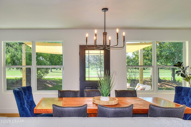 550 Eagle Dr, Holly Hill, FL 32117 - dining room featuring a chandelier
