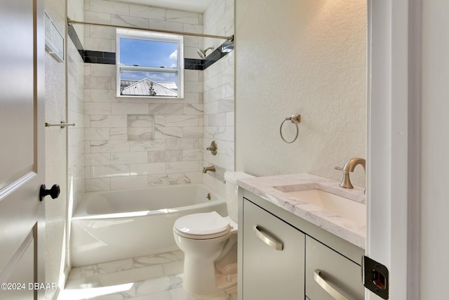 full bathroom with vanity, tiled shower / bath combo, and toilet