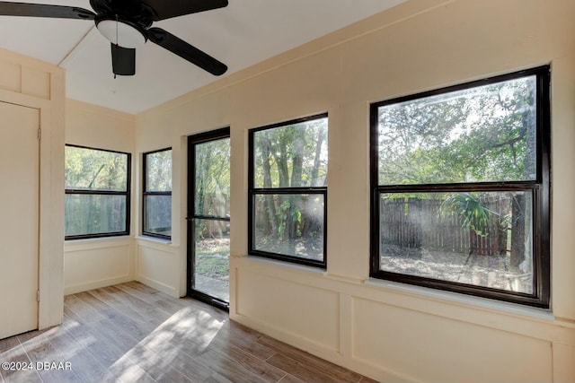 empty room featuring ceiling fan and light wood-type flooring