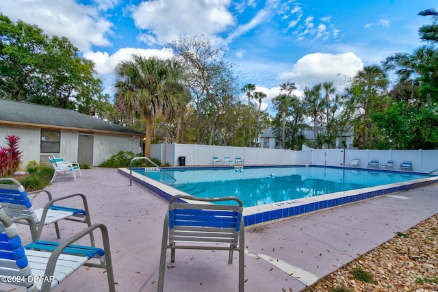 view of swimming pool with a patio area