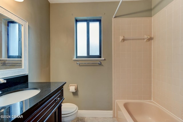 full bathroom featuring tile patterned floors, vanity, toilet, and tiled shower / bath combo