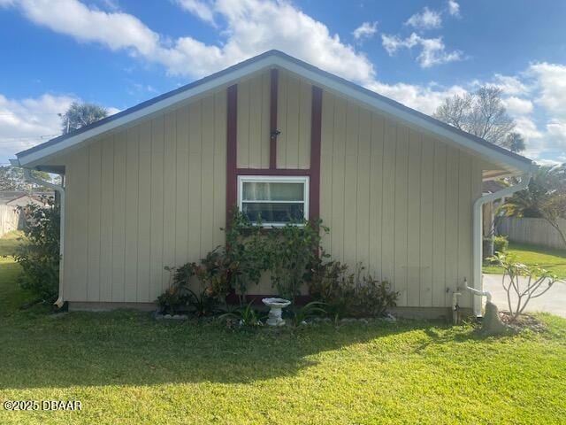 view of home's exterior with a lawn