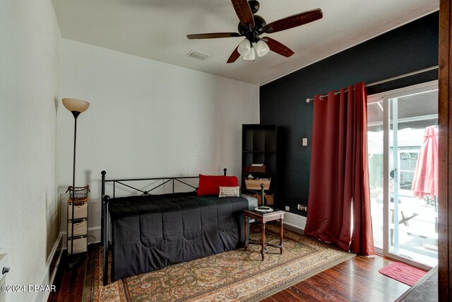 bedroom featuring access to outside, wood-type flooring, and ceiling fan