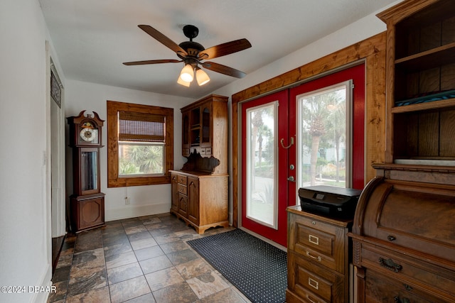 doorway with ceiling fan