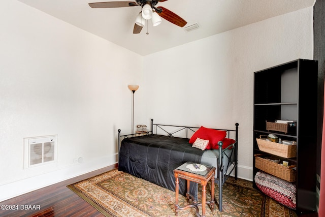 bedroom featuring dark wood-type flooring and ceiling fan