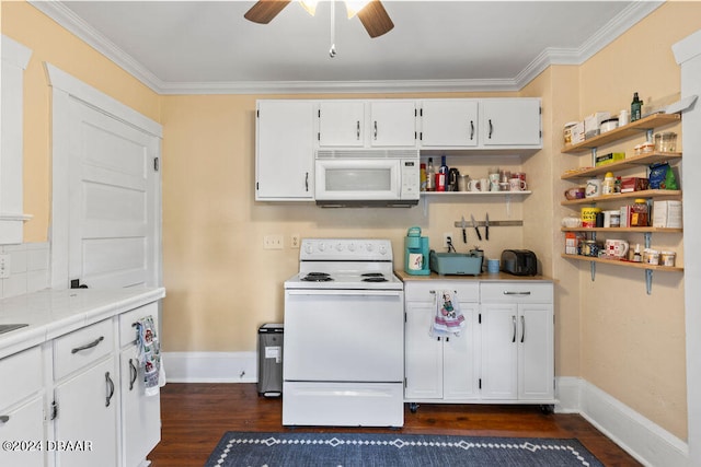 kitchen featuring white cabinets, white appliances, dark hardwood / wood-style floors, and crown molding