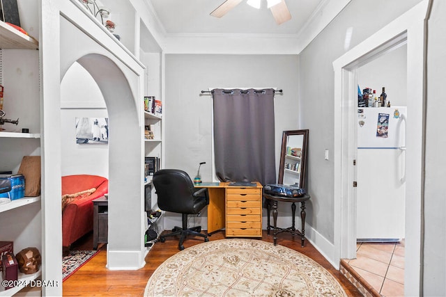 office space featuring ornamental molding, hardwood / wood-style flooring, and ceiling fan