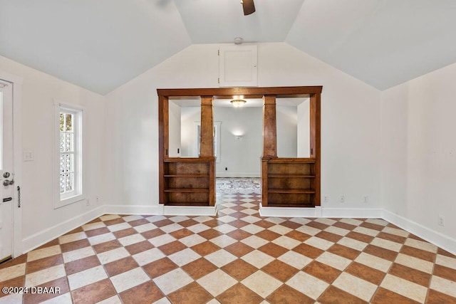 interior space featuring ceiling fan and vaulted ceiling