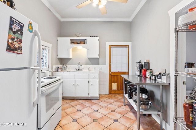 kitchen featuring white cabinetry, ornamental molding, sink, and white appliances