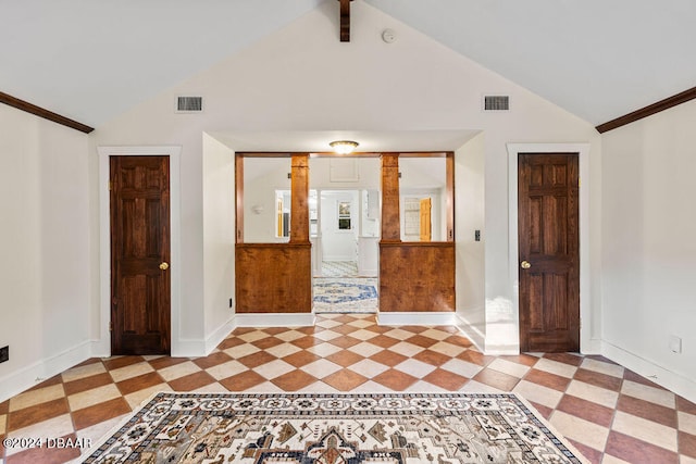 unfurnished room with vaulted ceiling