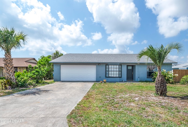 ranch-style home with a garage and a front yard