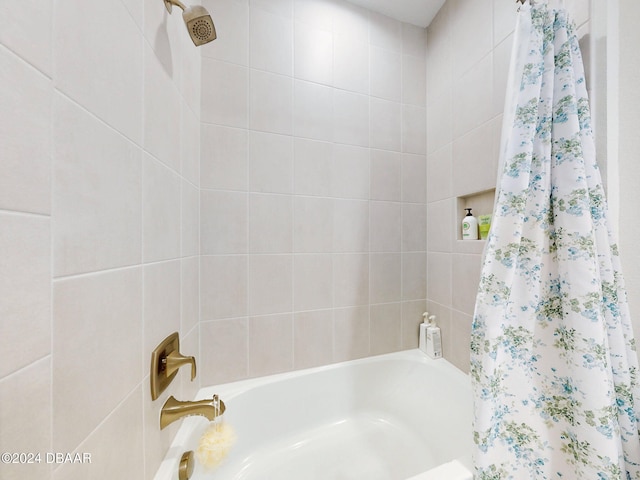 bathroom featuring shower / tub combo with curtain