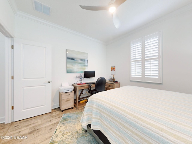 bedroom featuring ceiling fan, ornamental molding, and light hardwood / wood-style floors