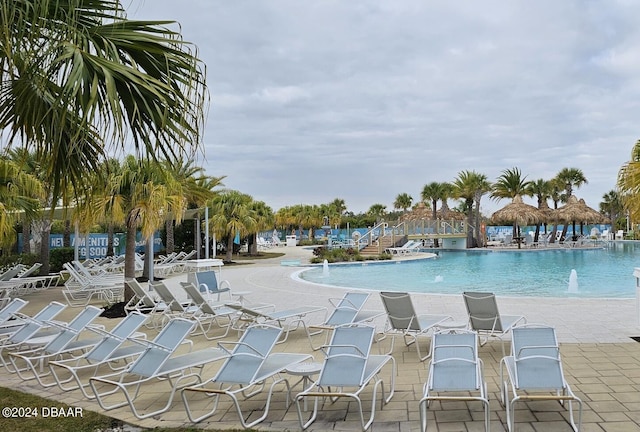 view of pool featuring a patio area and pool water feature