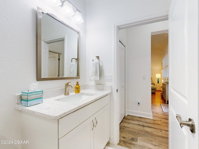 bathroom featuring vanity and hardwood / wood-style flooring