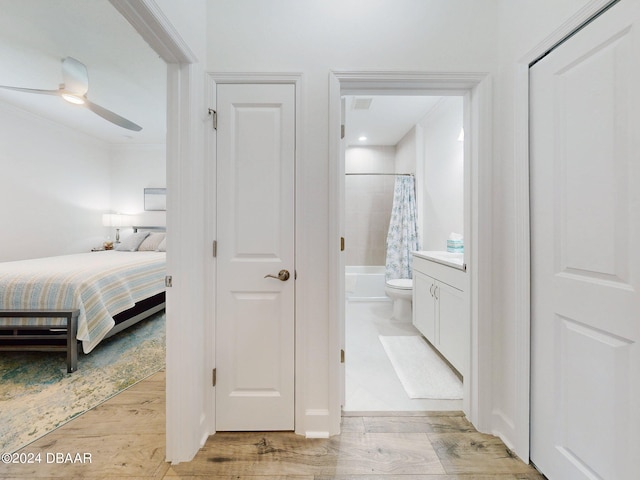 interior space with connected bathroom and light hardwood / wood-style flooring