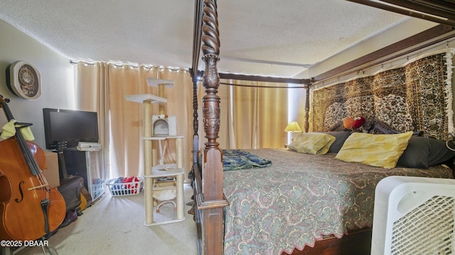 bedroom featuring carpet flooring and a textured ceiling