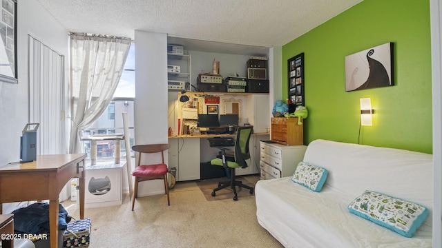 bedroom featuring multiple windows, carpet, and a textured ceiling