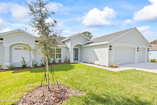 single story home with an attached garage, concrete driveway, a front lawn, stucco siding, and a shingled roof