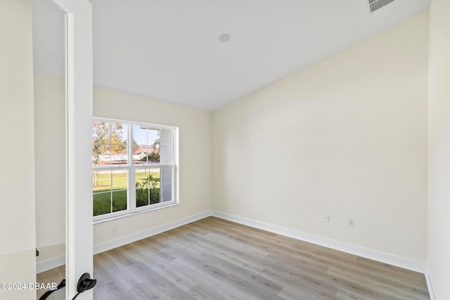 unfurnished room with light wood-style floors and baseboards