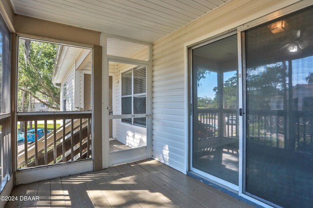 unfurnished sunroom featuring wood ceiling