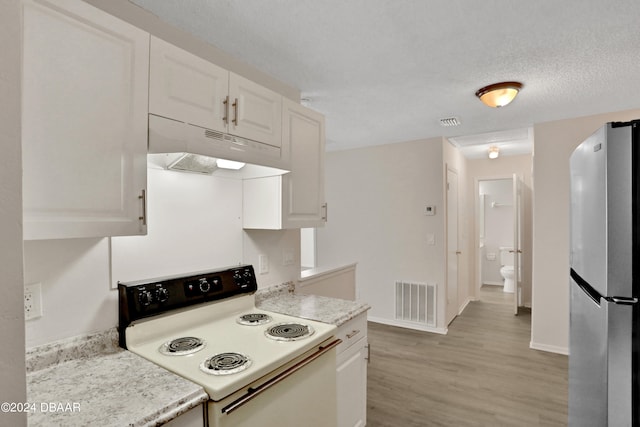 kitchen with stainless steel fridge, a textured ceiling, light hardwood / wood-style floors, white cabinets, and white electric range