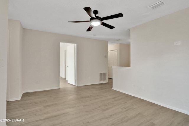 unfurnished room with light wood-type flooring and ceiling fan