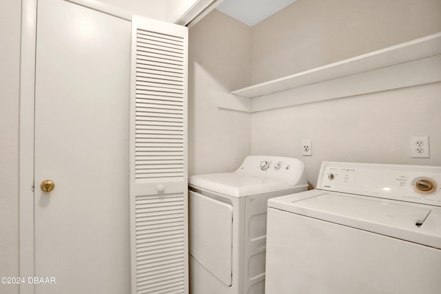 laundry room with independent washer and dryer