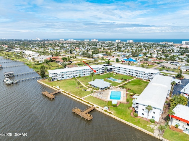 bird's eye view featuring a water view and a city view