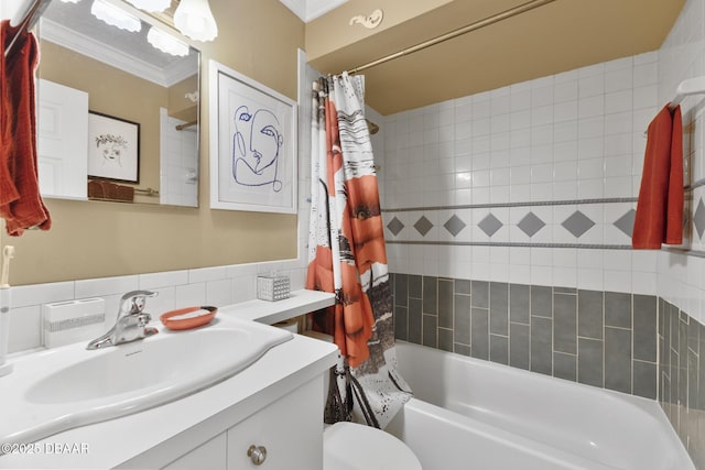 bathroom with vanity, toilet, ornamental molding, and shower / bath combo