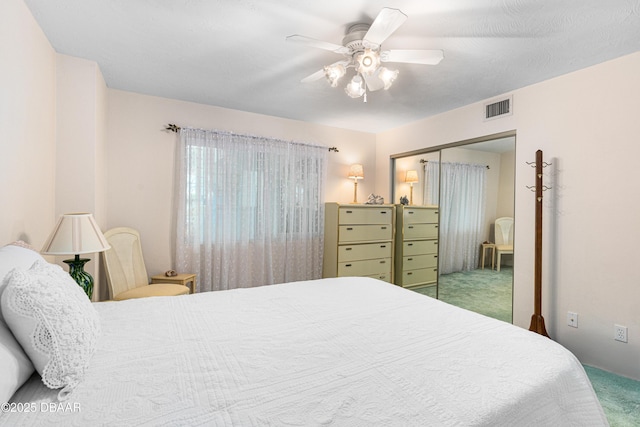 2545 S Atlantic Ave Unit 0102, Daytona Beach Shores, FL 32118 - carpeted bedroom with a closet and ceiling fan