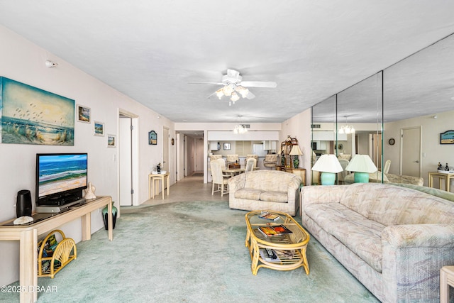 2545 S Atlantic Ave Unit 0102, Daytona Beach Shores, FL 32118 - living area featuring a ceiling fan and carpet floors