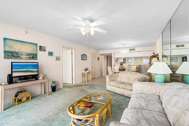 2545 S Atlantic Ave Unit 0102, Daytona Beach Shores, FL 32118 - living room with carpet flooring, a ceiling fan, and a chandelier