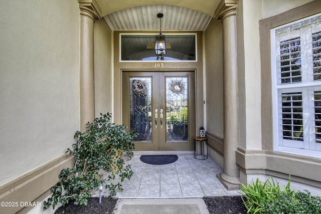 view of exterior entry featuring french doors