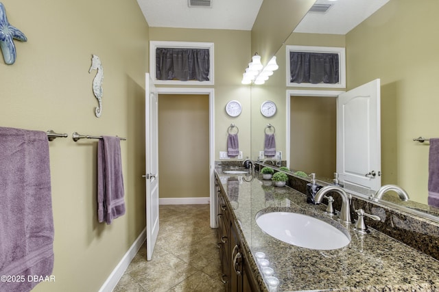 bathroom with vanity and tile patterned flooring