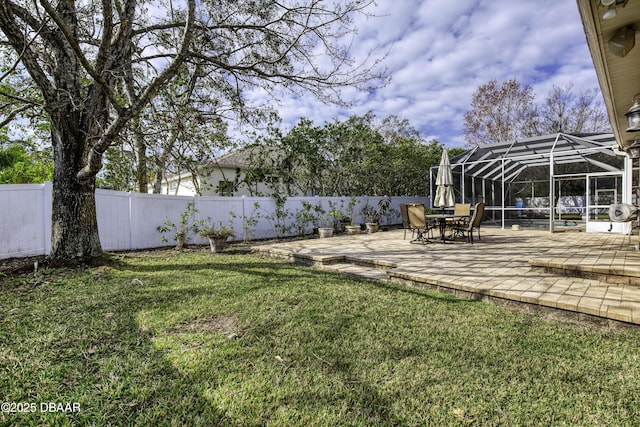 view of yard featuring a lanai and a patio area