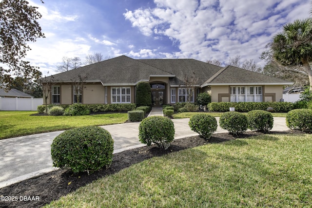 single story home with a front yard