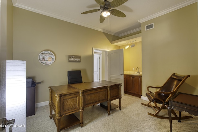 carpeted office featuring crown molding, ceiling fan, and sink