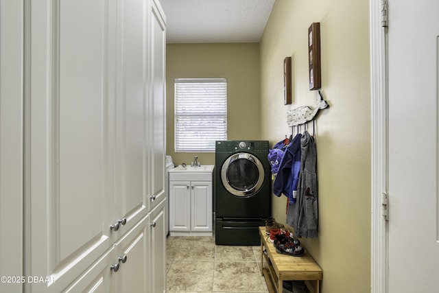 laundry room with cabinets, washer / dryer, sink, and light tile patterned floors