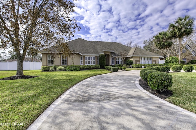 ranch-style house with a front lawn