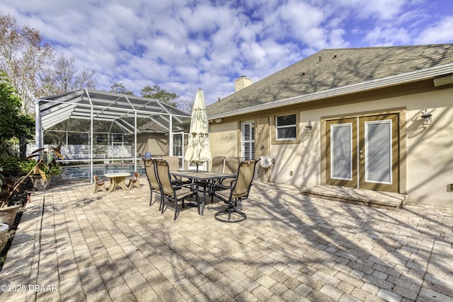 view of patio / terrace with glass enclosure