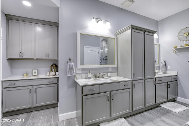 bathroom with wood-type flooring and vanity